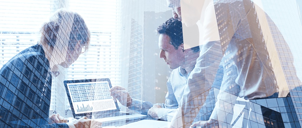 Banner image of three office workers reviewing financial data on a laptop screen